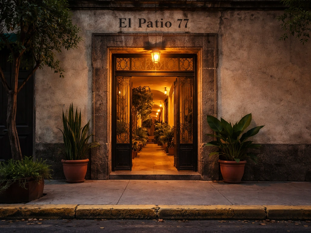 Street-level entrance to a venue in Mexico City, with subtle signage indicating “El Patio 77”.